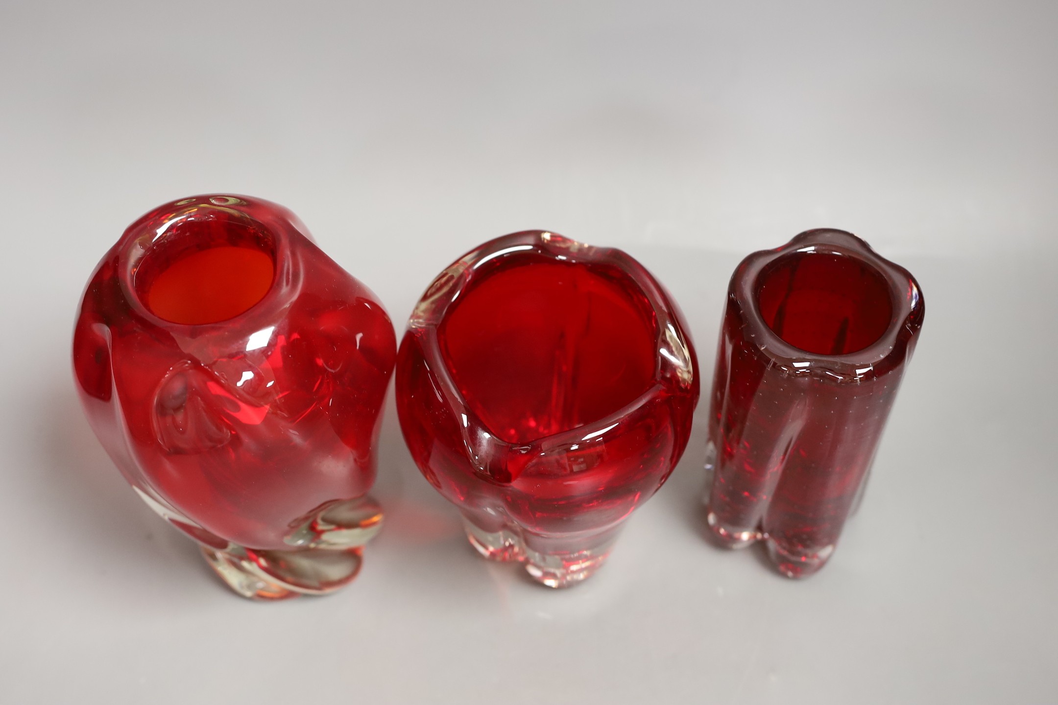 Three Whitefriars red glass vases, tallest 18cms high